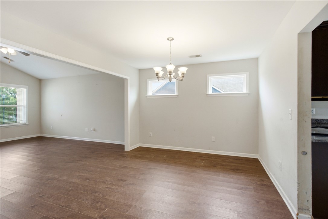 245 Maple Grove Road Seneca, SC 29678 - Photo 9 of 40 This inviting space features durable flooring and abundant natural light, creating an ideal setting for gatherings.