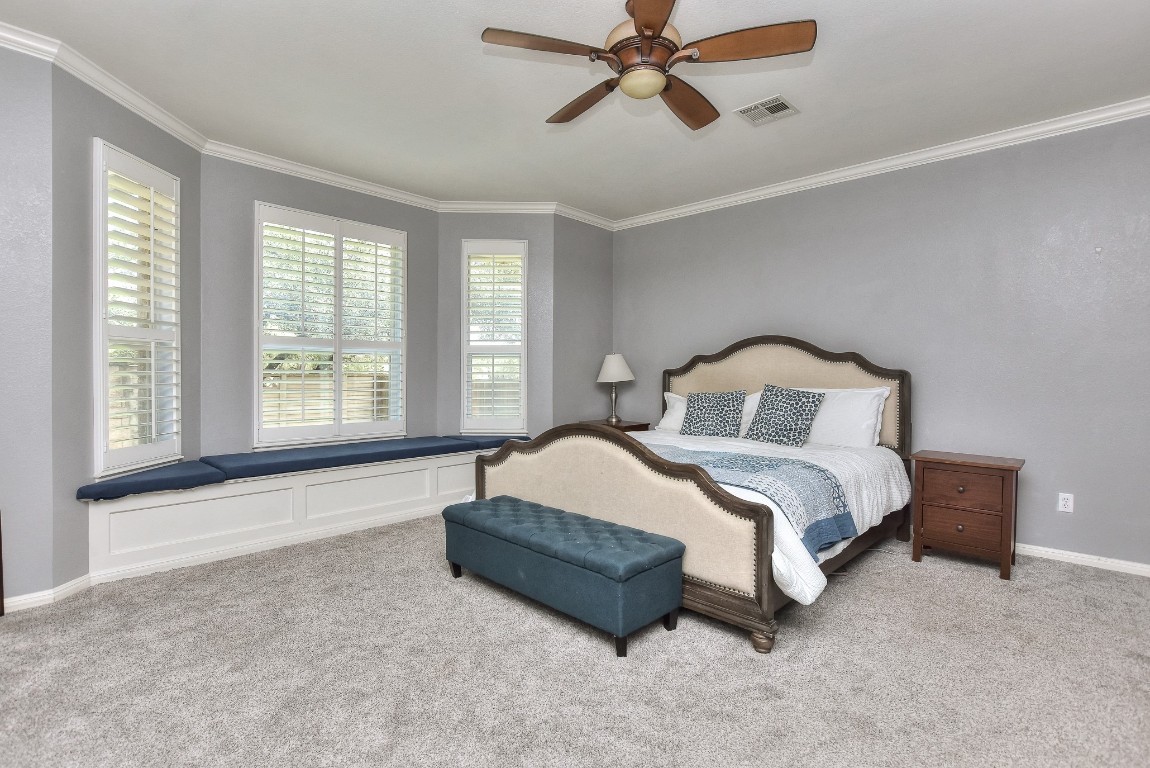 1108 Ritter Drive Cedar Park, TX 78613 - Photo 19 of 40 Large first floor primary suite complete with big bay window and custom built in storage bench seats.