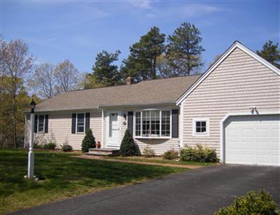 50 Oxner Road Centerville, MA 02632 - Photo 1 of 12 a view of a house with yard and plants