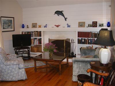 50 Oxner Road Centerville, MA 02632 - Photo 2 of 12 a living room with furniture and a fireplace
