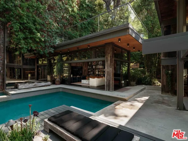 a view of a backyard with sitting area