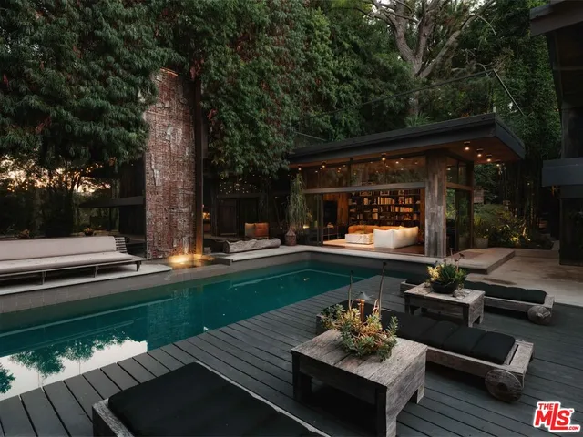 a view of swimming pool with a patio