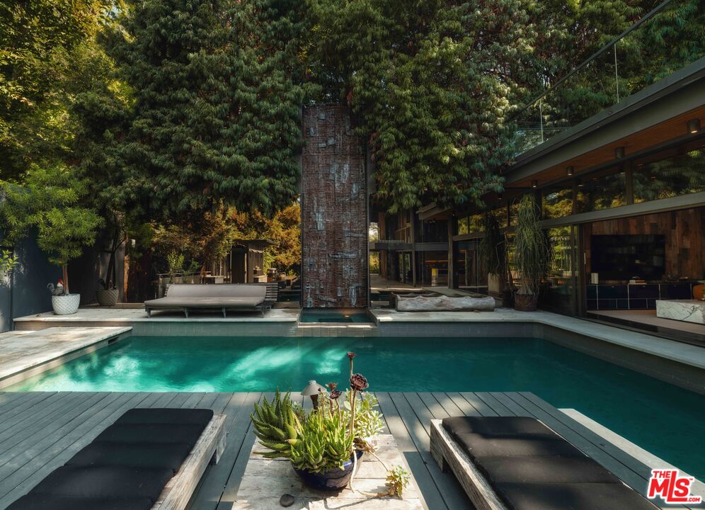 2563 Nichols Canyon Road Los Angeles, CA 90046 - Photo 9 of 32 a view of a swimming pool with a patio