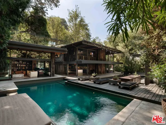 a small pool with a table and chairs