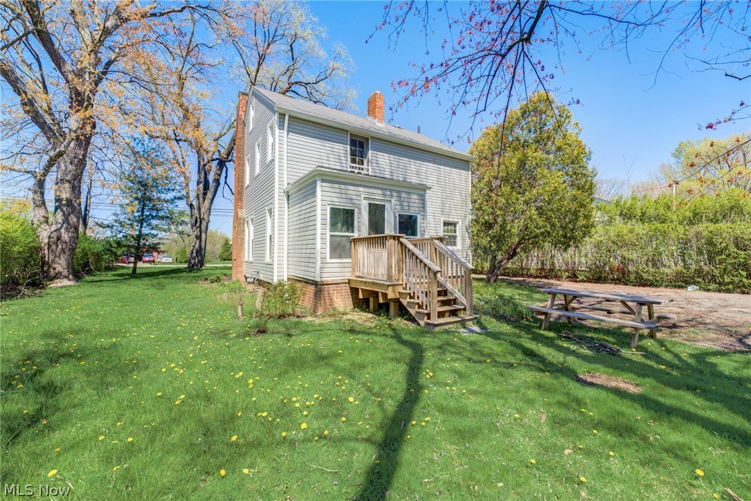 25819 Center Ridge Road Westlake, OH 44145 - Photo 34 of 45 Rear view of property featuring a wooden porch and a lawn