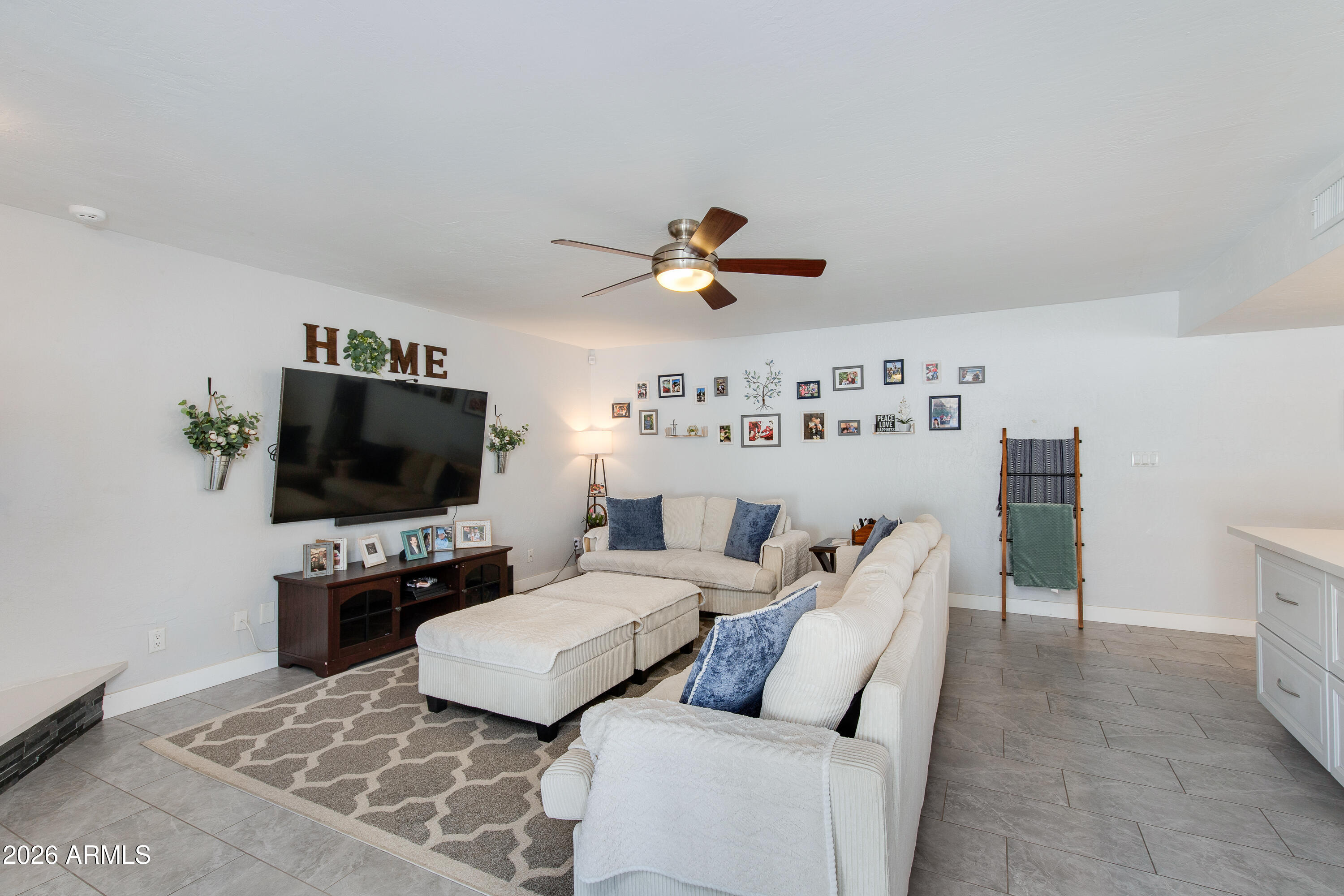8219 North 3rd Avenue Phoenix, AZ 85021 - Photo 24 of 52 a living room with furniture and a flat screen tv