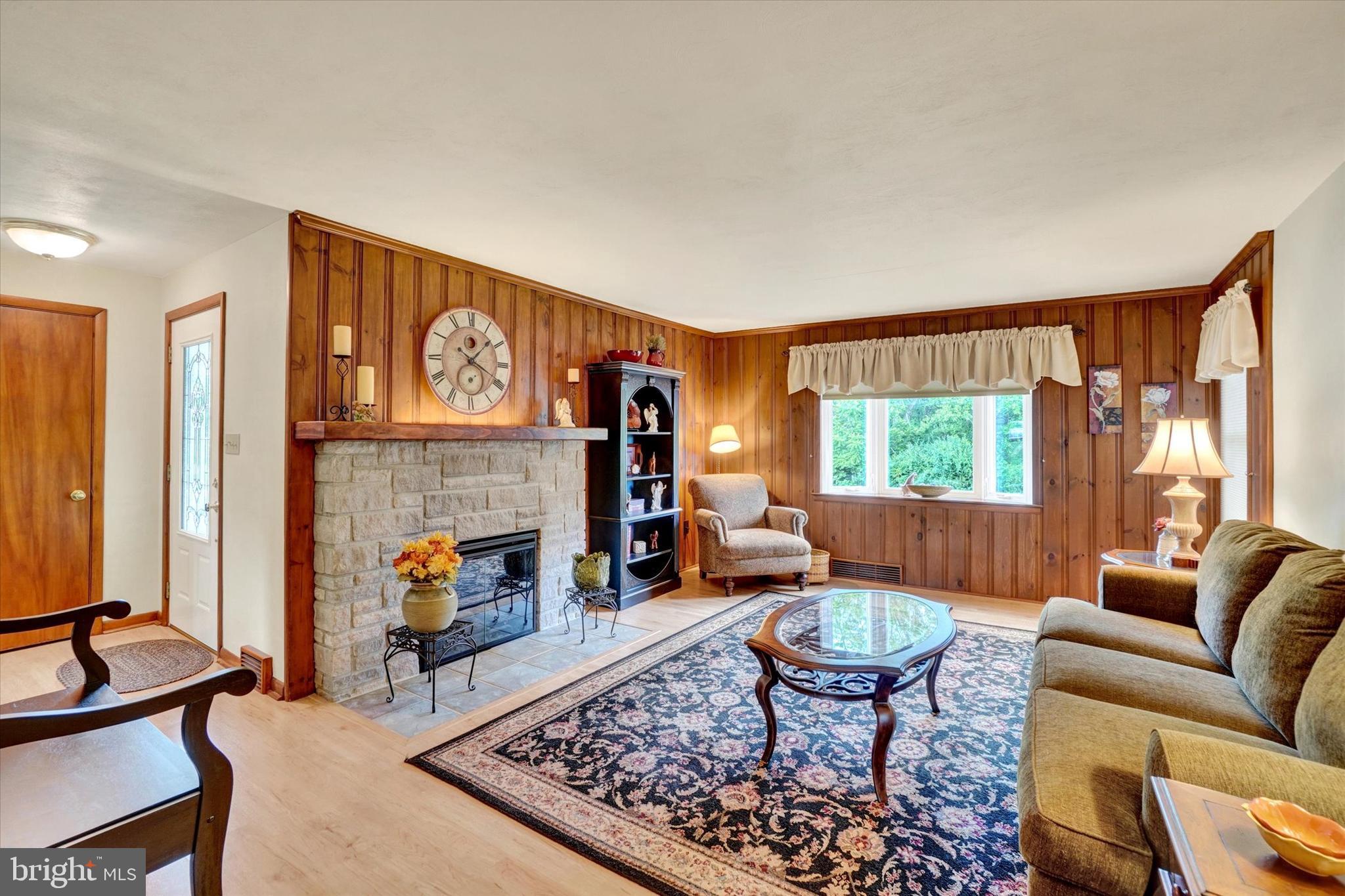 285 South Main Street Mount Wolf, PA 17347 - Photo 5 of 34 a living room with furniture and a fireplace