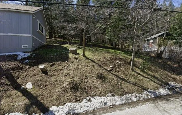 a backyard of a house with lots of green space