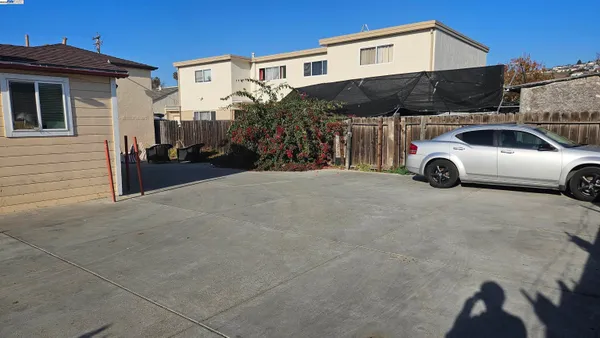 a view of a car parked in front of a house