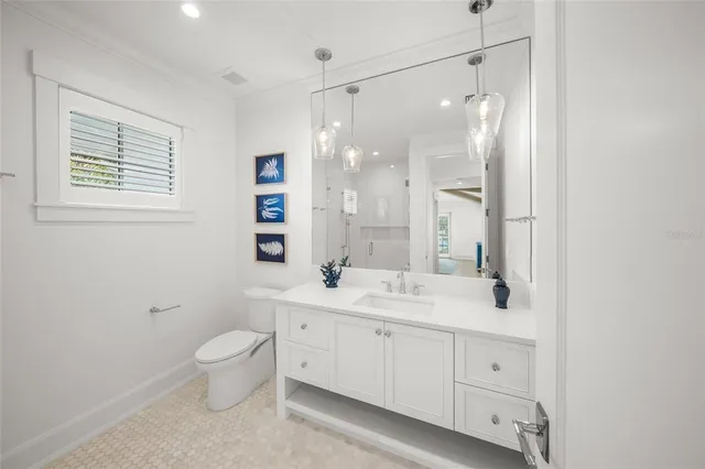 a view of a kitchen with furniture and wooden floor