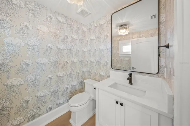 a view of a kitchen with a sink and a large window