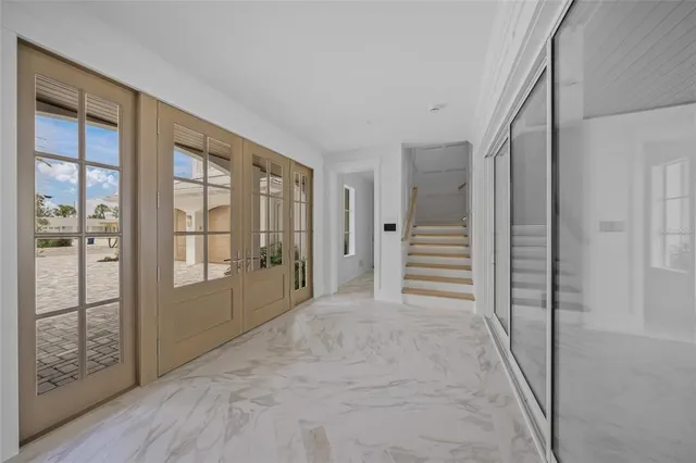a view of staircase with lots of frames and wooden floor