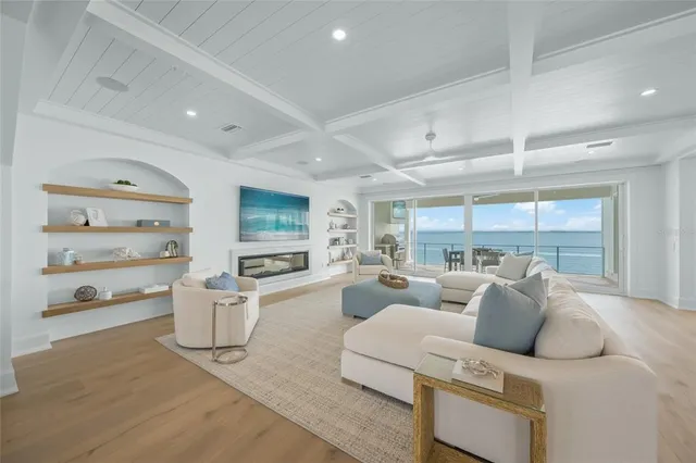 a large kitchen with stainless steel appliances granite countertop a lot of counter space and wooden floor