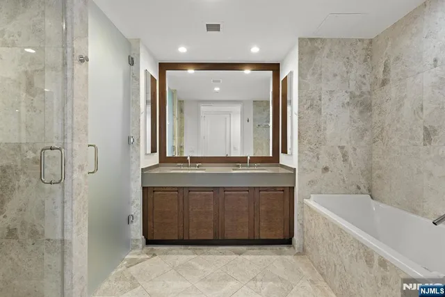a bathroom with a bathtub and a sink