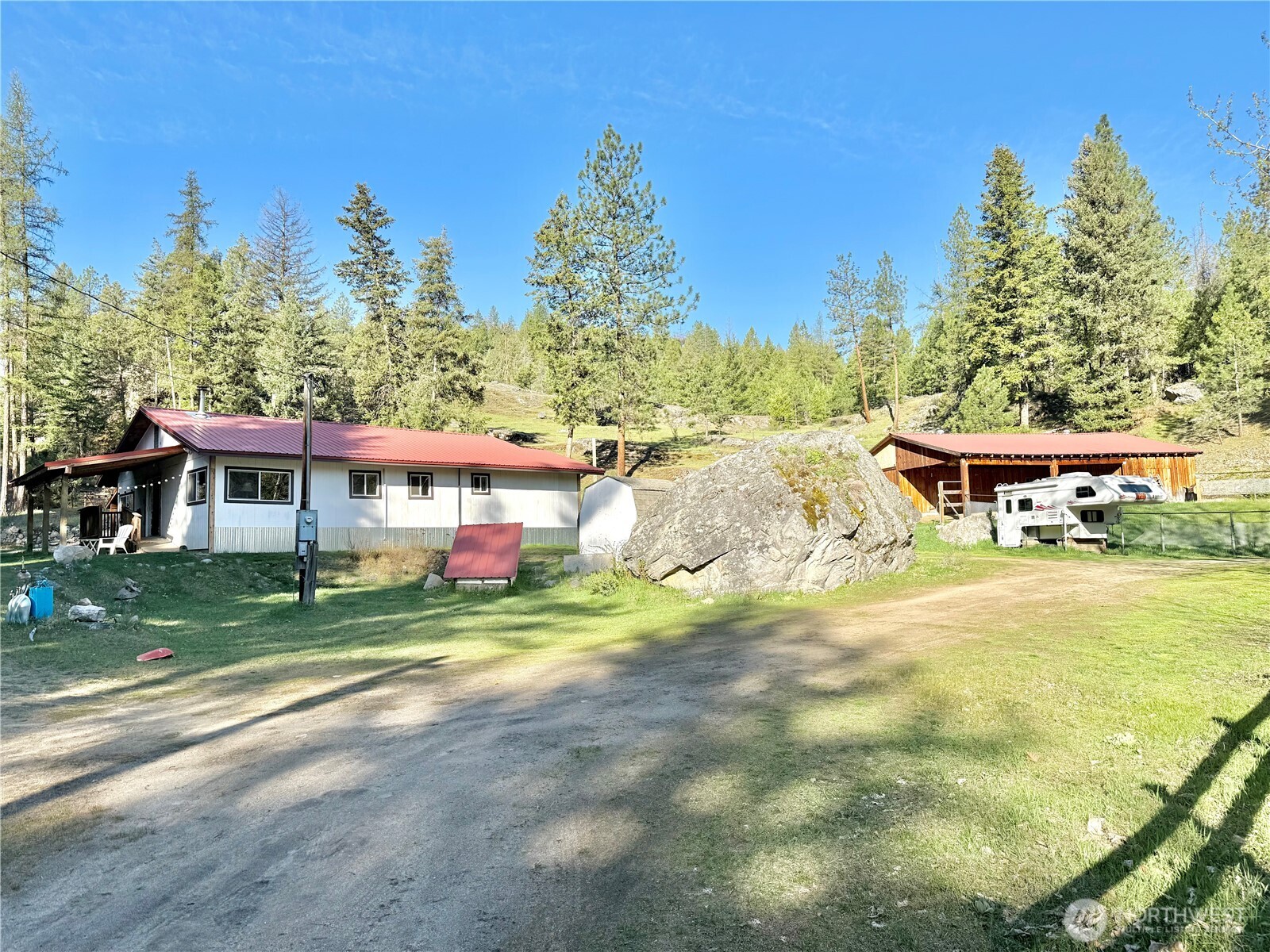 1092 Aeneas Valley Road Tonasket, WA 98855 - Photo 12 of 40 a view of a big yard next to a yard