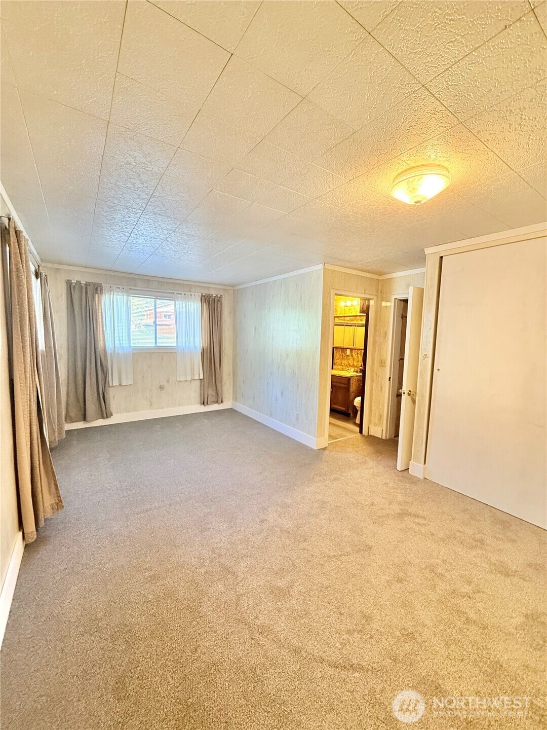 1092 Aeneas Valley Road Tonasket, WA 98855 - Photo 24 of 40 a view of an empty room with a window