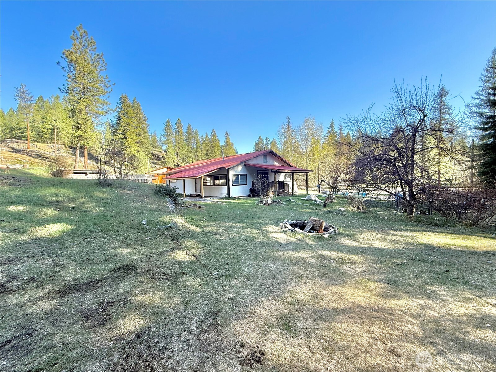 1092 Aeneas Valley Road Tonasket, WA 98855 - Photo 3 of 40 a front view of a house with garden