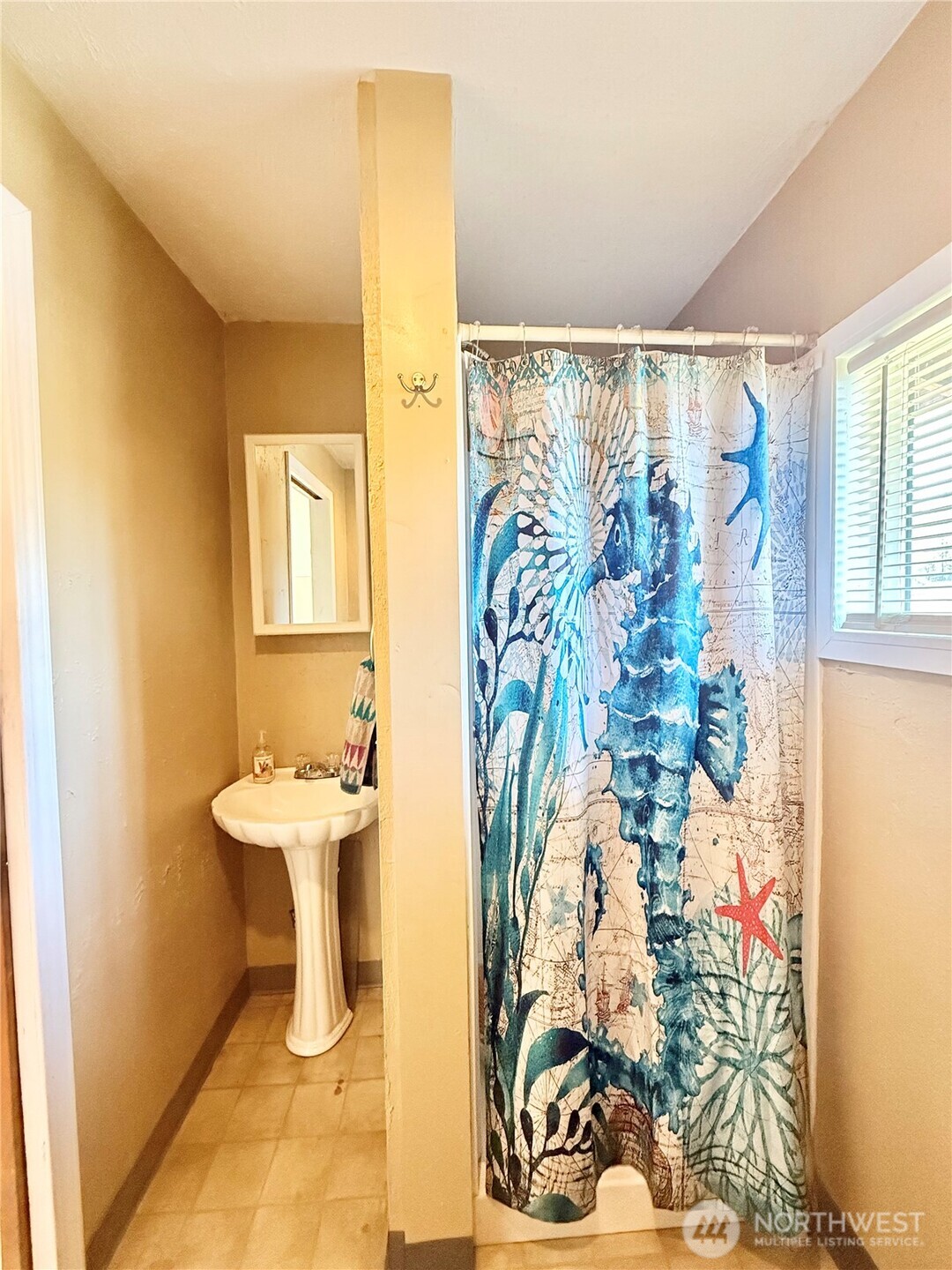 1092 Aeneas Valley Road Tonasket, WA 98855 - Photo 34 of 40 a bathroom with a sink and mirror with toilet