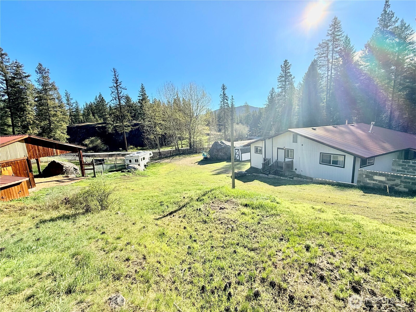1092 Aeneas Valley Road Tonasket, WA 98855 - Photo 8 of 40 a view of a house with swimming pool and sitting area