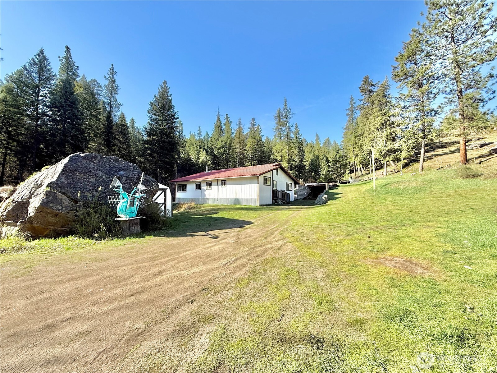 1092 Aeneas Valley Road Tonasket, WA 98855 - Photo 9 of 40 a view of an outdoor space and swimming pool