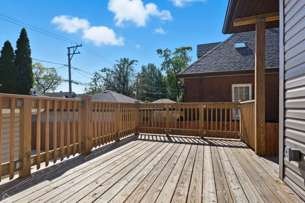 a view of deck with wooden floor and fence