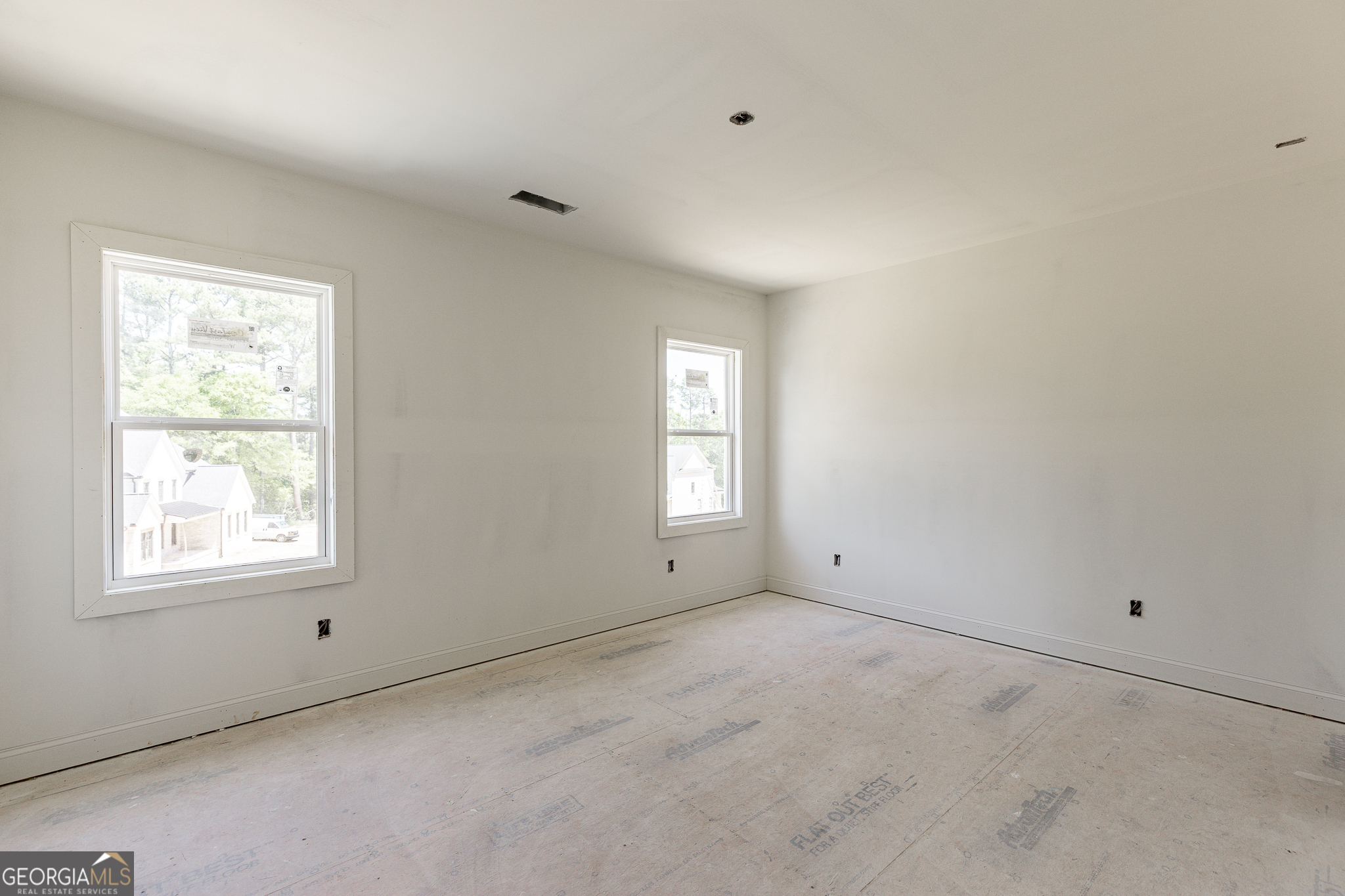 2969 North Bogan Road Northeast, Unit 1 Buford, GA 30519 - Photo 33 of 51 a view of an empty room with a window
