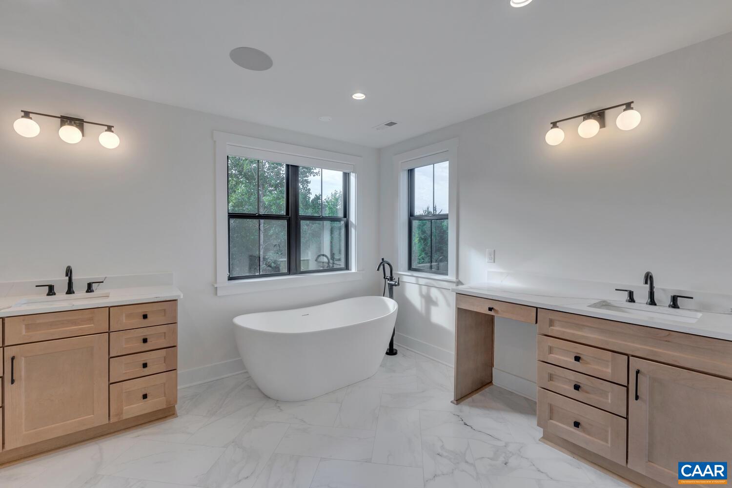 3 Jarmans Gap Road, Unit LOT 3 JARMANS GAP Crozet, VA 22932 - Photo 34 of 39 a spacious bathroom with a double vanity sink a large mirror a bathtub and window