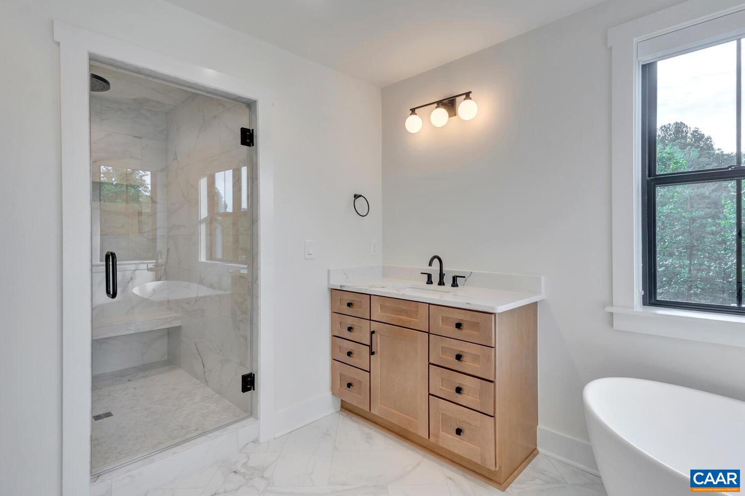3 Jarmans Gap Road, Unit LOT 3 JARMANS GAP Crozet, VA 22932 - Photo 36 of 39 a spacious bathroom with a double vanity sink a toilet and a shower
