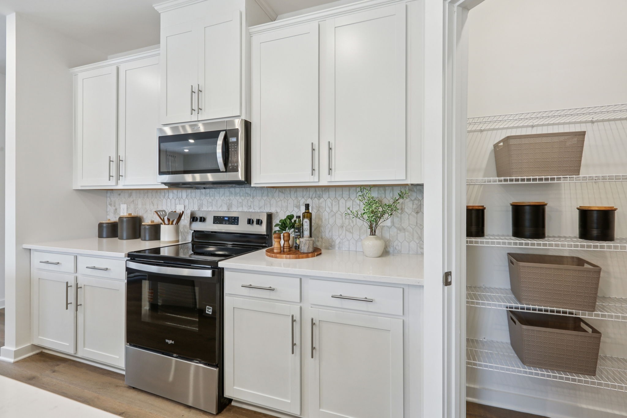 7165 Cedarcrest Lane Fairview, TN 37062 - Photo 16 of 49 a kitchen with stainless steel appliances granite countertop a stove a sink and a microwave
