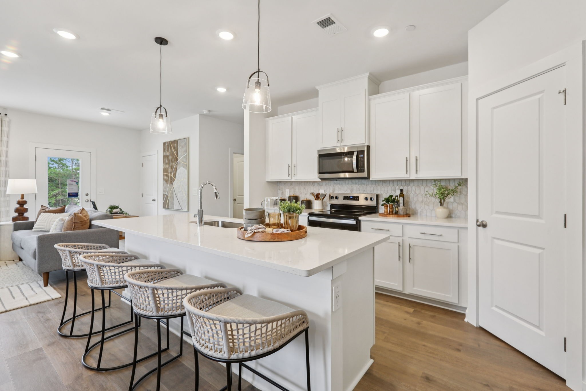 7165 Cedarcrest Lane Fairview, TN 37062 - Photo 17 of 49 a kitchen with white cabinets and stainless steel appliances