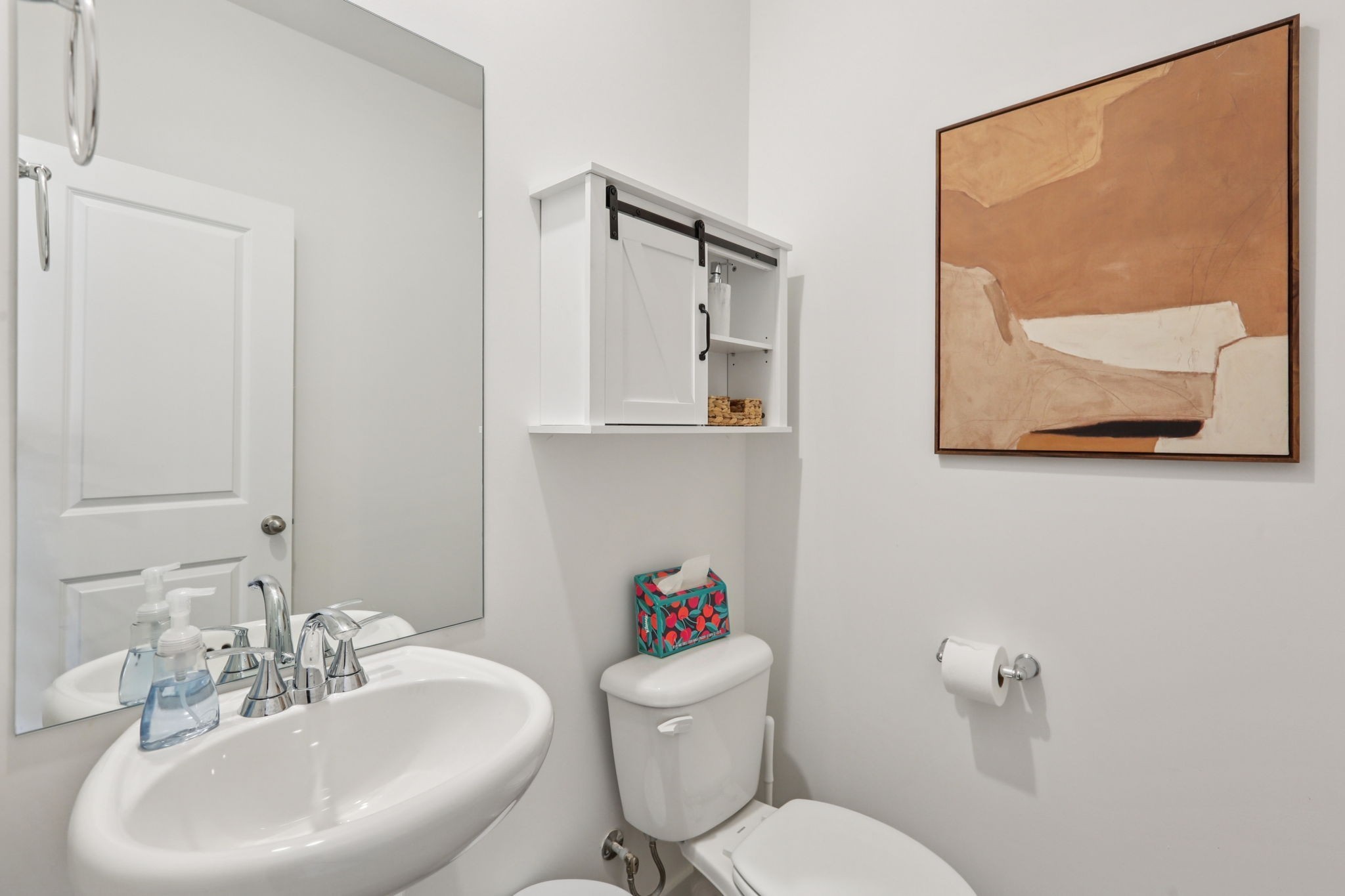 7165 Cedarcrest Lane Fairview, TN 37062 - Photo 18 of 49 a bathroom with a toilet a sink and mirror