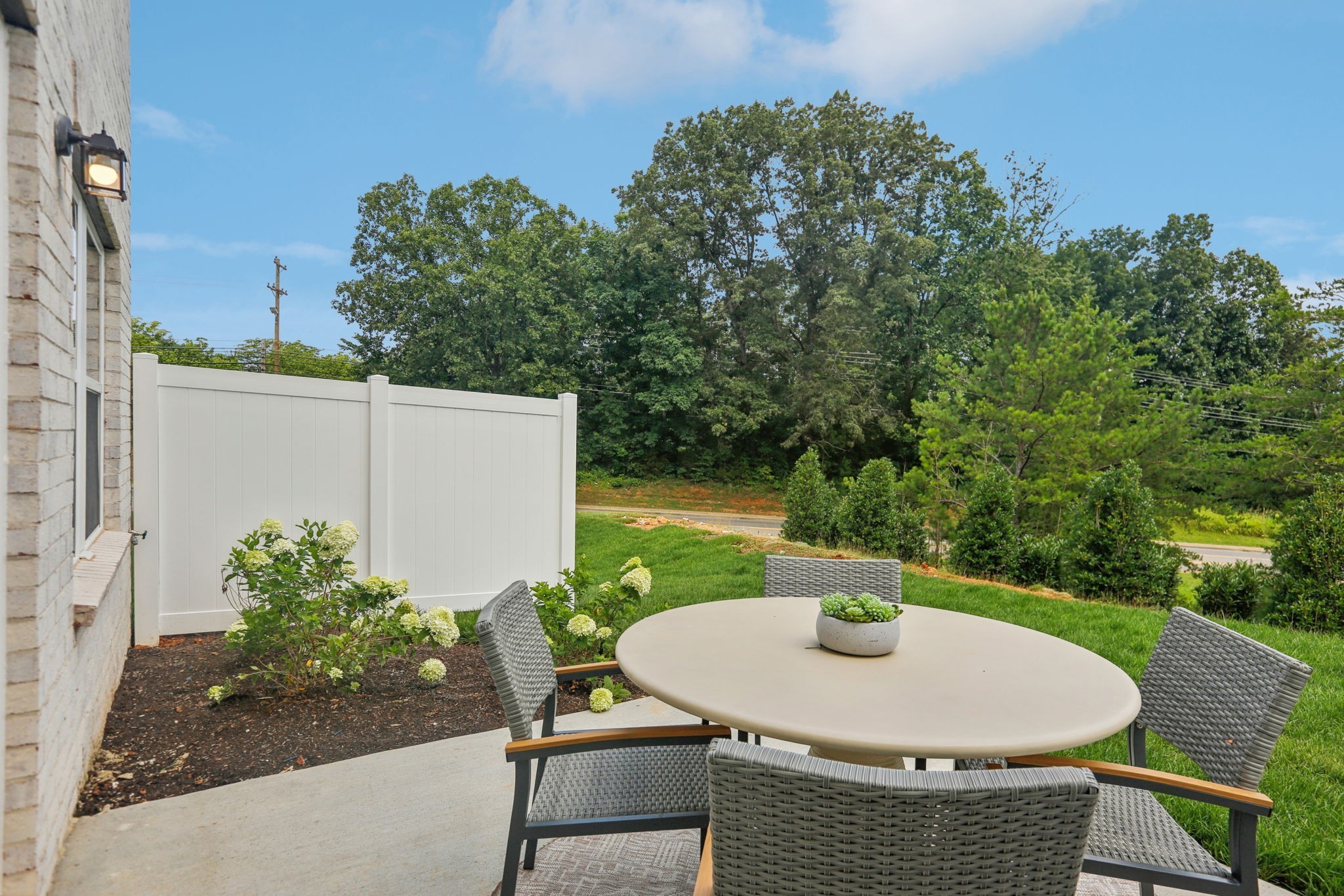 7165 Cedarcrest Lane Fairview, TN 37062 - Photo 42 of 49 a backyard of a house with table and chairs
