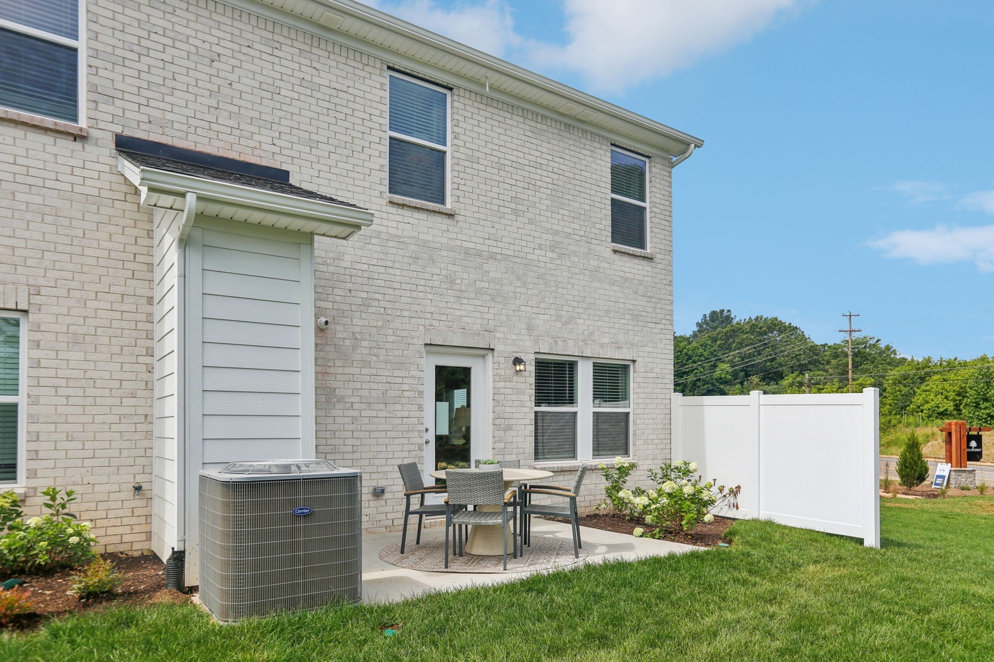7165 Cedarcrest Lane Fairview, TN 37062 - Photo 45 of 49 a backyard of a house with table and chairs