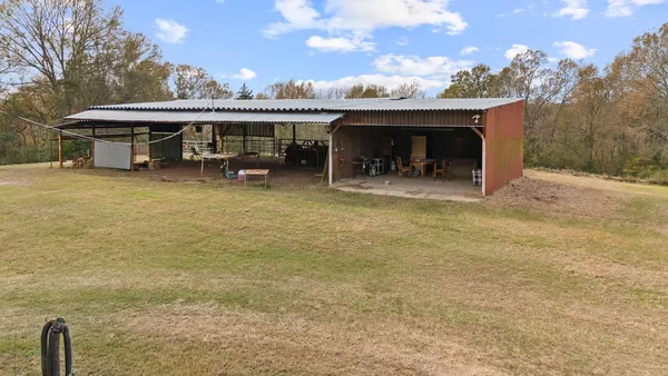 a view of a lake with house and outdoor space