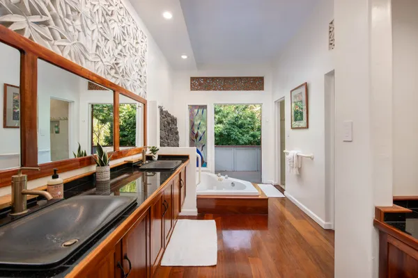 a kitchen with stainless steel appliances granite countertop sink stove and cabinets