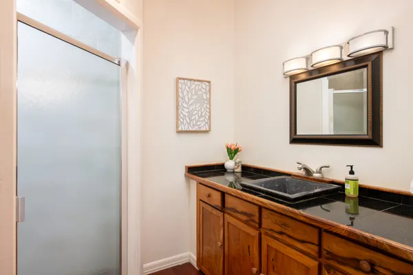 a bathroom with a sink and a mirror