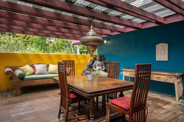 a dining room with furniture and wooden floor