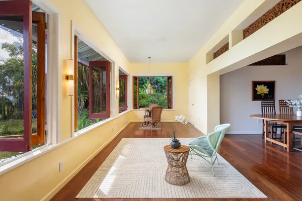 a view of a dining room with furniture window and wooden floor