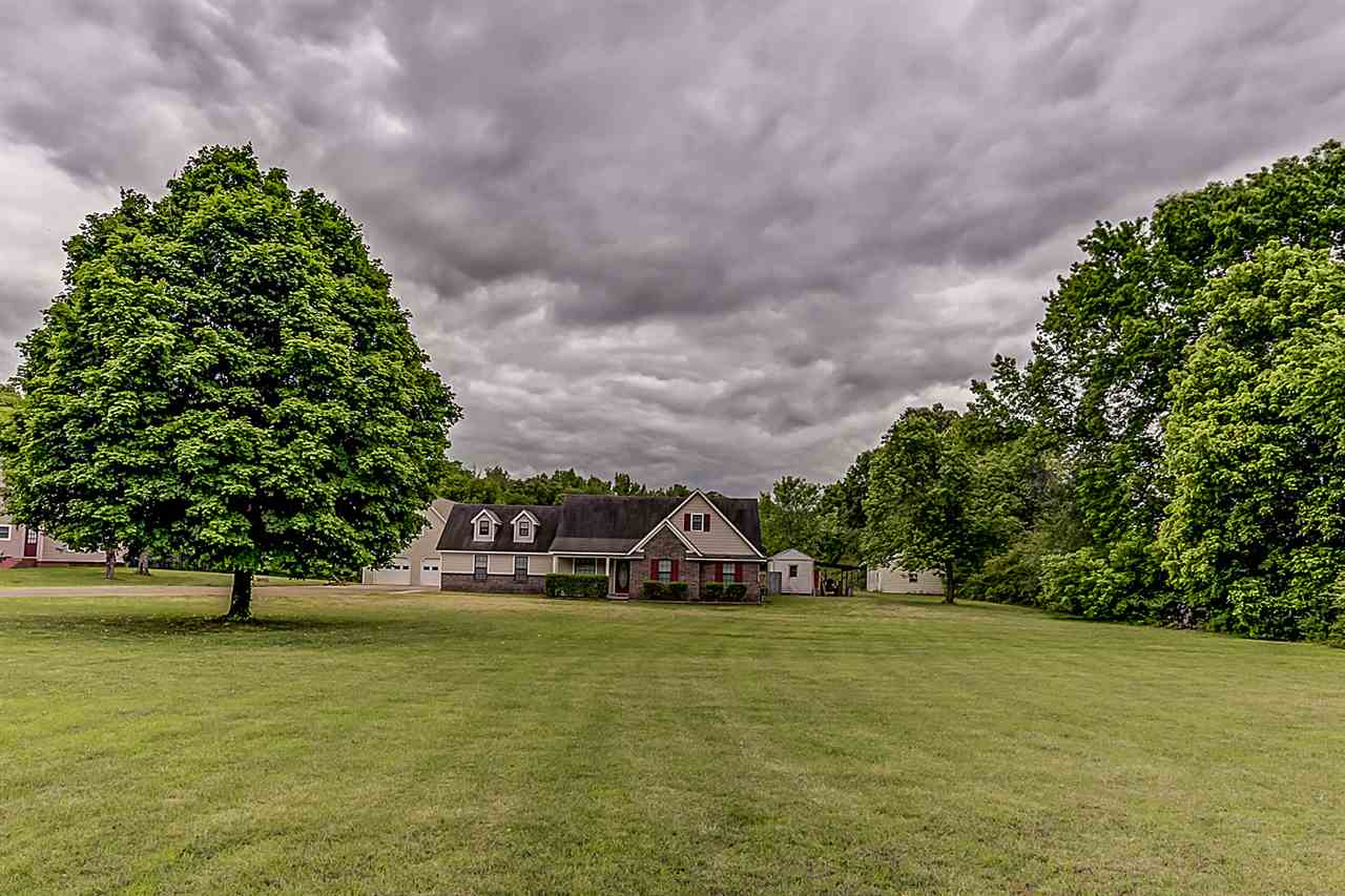 9445 Pleasant Ridge Road Lakeland, TN 38002 - Photo 1 of 21 Country Living In LAKELAND! Over 2600 sq ft of living quietly sits on this large 5.5 acre piece of land.