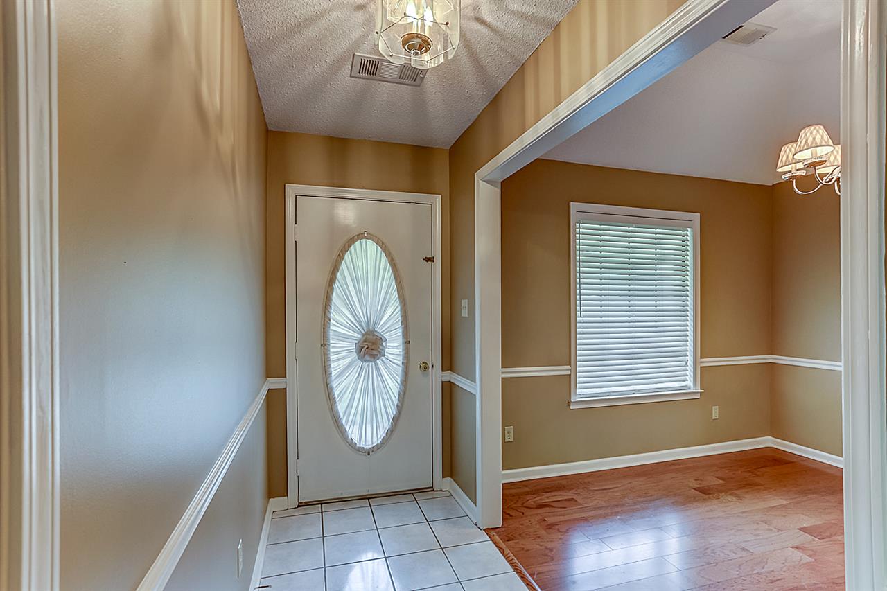 9445 Pleasant Ridge Road Lakeland, TN 38002 - Photo 2 of 21 Entry hall foyer with ceramic tile, coat closet and chair rail. New interior paint throughout!