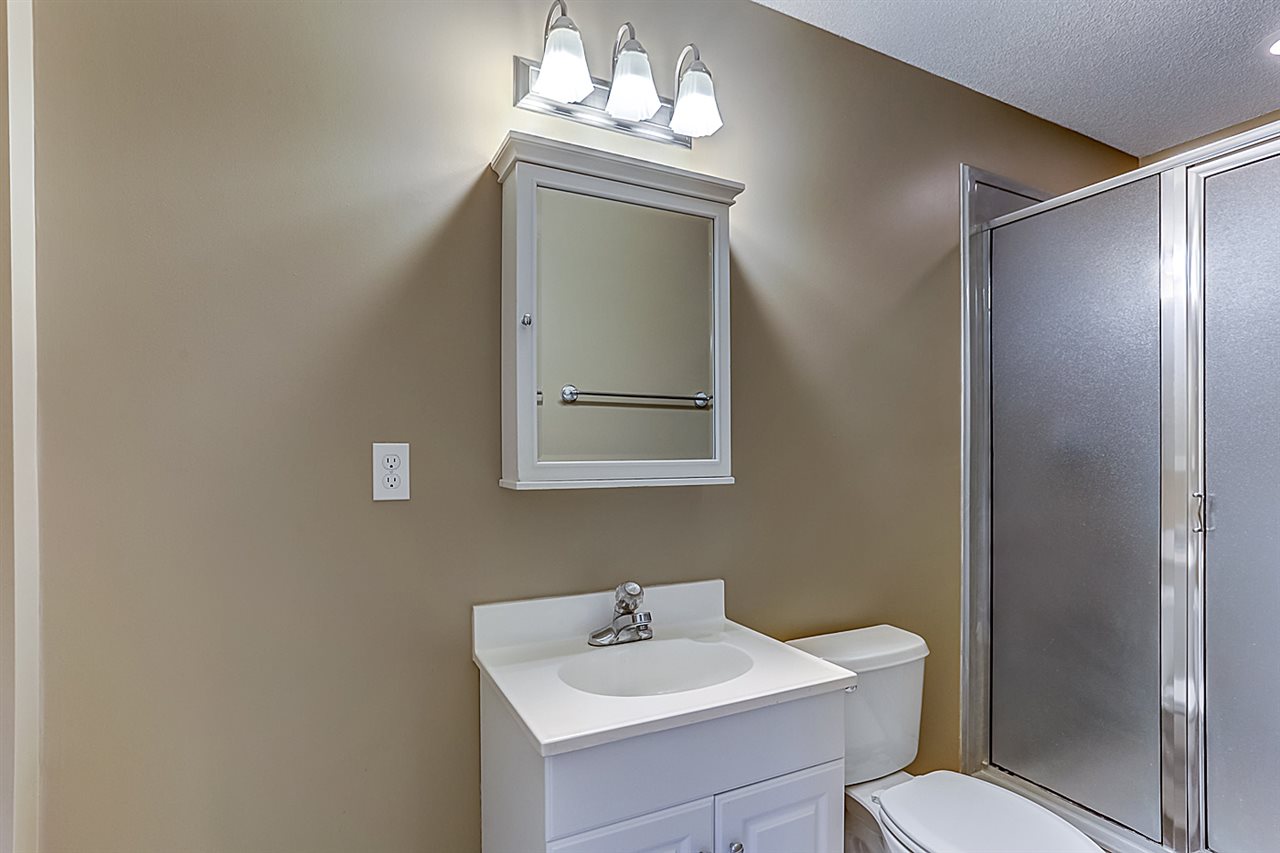 9445 Pleasant Ridge Road Lakeland, TN 38002 - Photo 11 of 21 This full bathroom is complete with ceramic tile, walk in shower and vanity mirror.