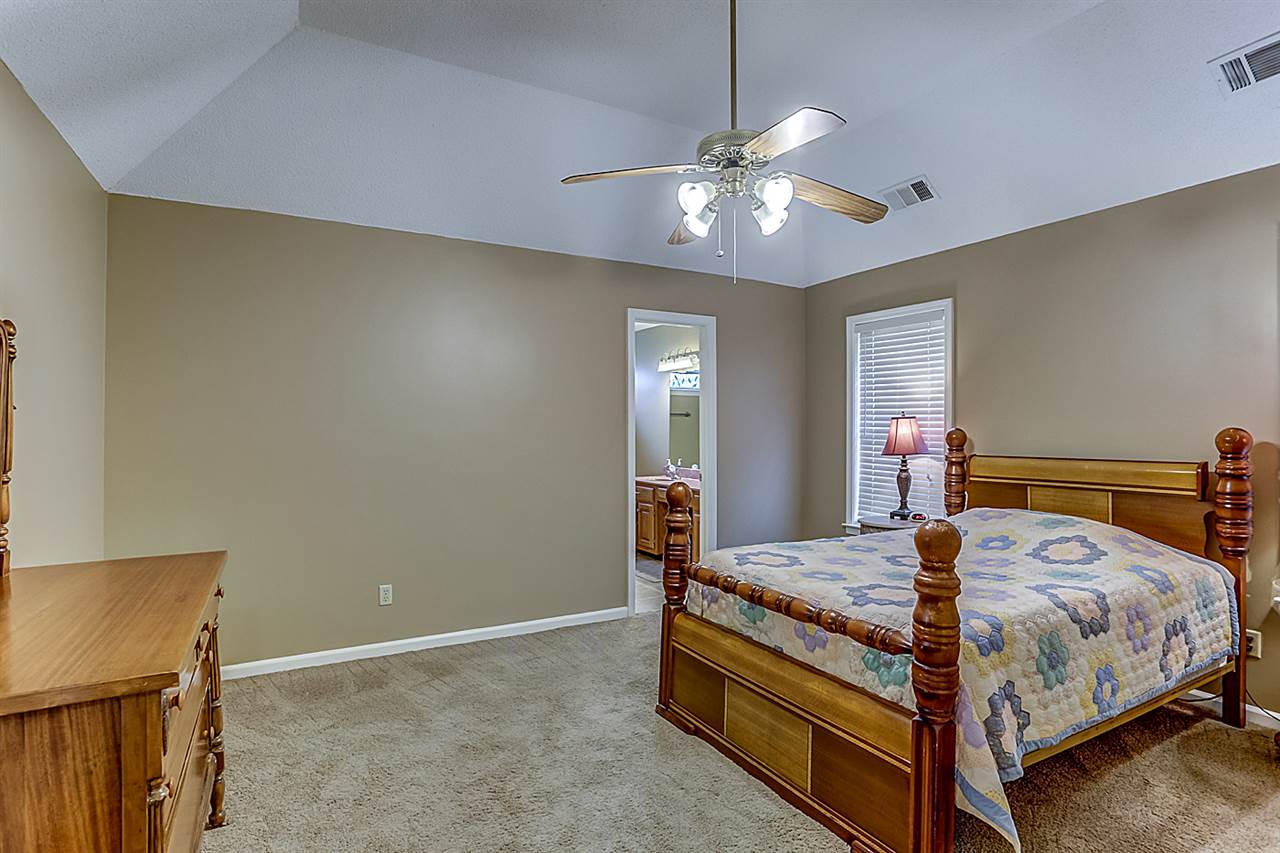 9445 Pleasant Ridge Road Lakeland, TN 38002 - Photo 12 of 21 The 15x13 Master Bedroom has vaulted ceilings, ceiling fan, carpet and 2 inch blinds.