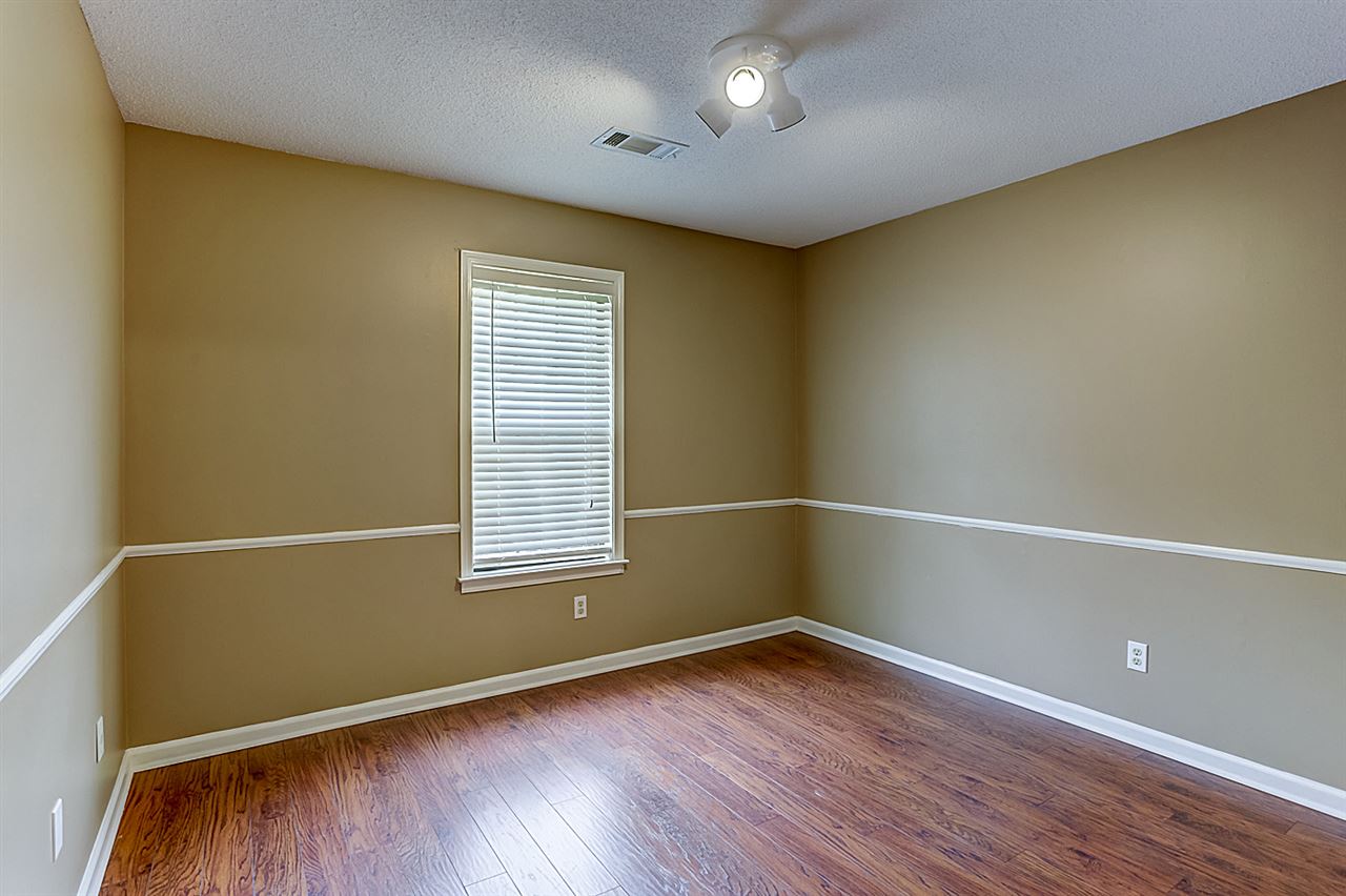9445 Pleasant Ridge Road Lakeland, TN 38002 - Photo 14 of 21 Bedroom 2 is 11x10 with Pergo flooring, 2 inch blinds and large closet.