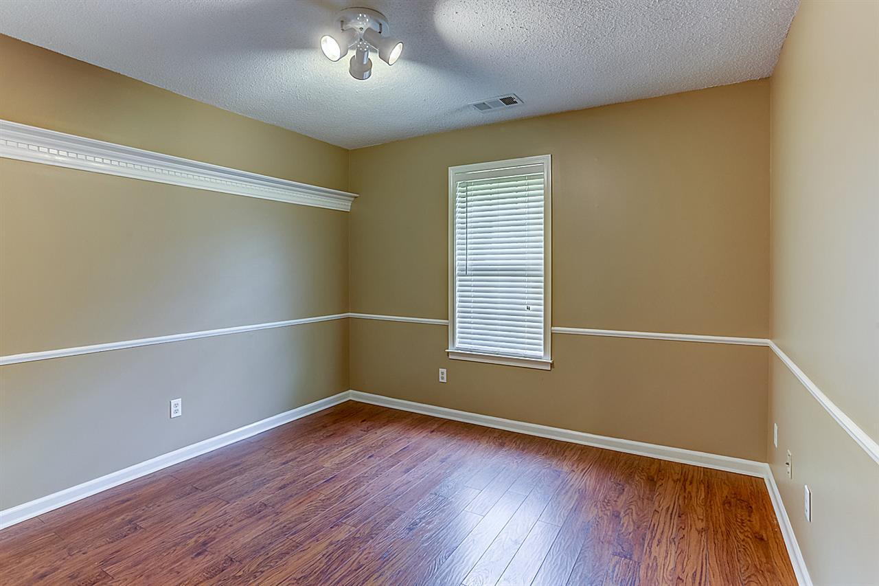 9445 Pleasant Ridge Road Lakeland, TN 38002 - Photo 16 of 21 The third downstairs bedroom is 11x10 with Pergo flooring, 2 inch blinds, large closet.