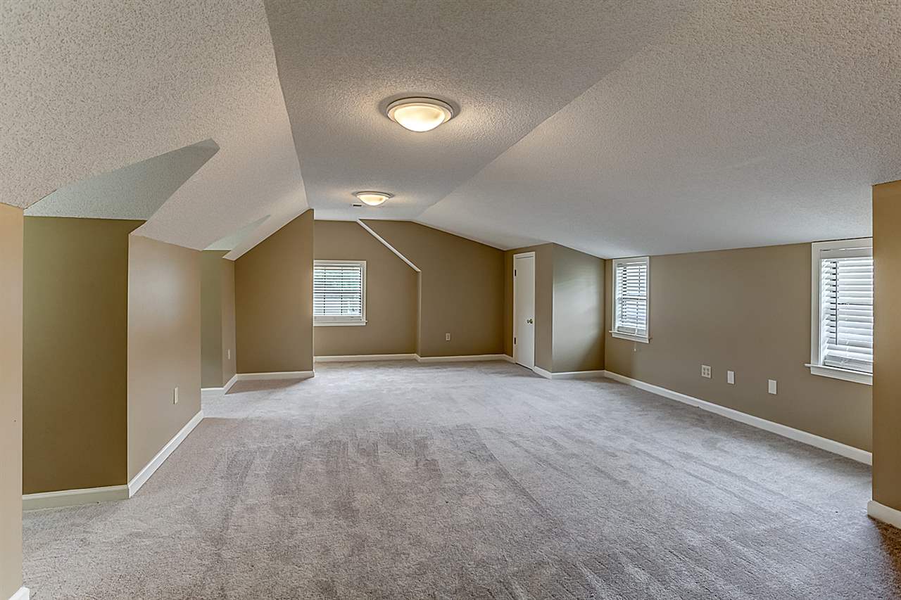9445 Pleasant Ridge Road Lakeland, TN 38002 - Photo 17 of 21 The 4th bedroom/Bonus is 23x16. Complete with a full walk in closet, new carpet, built in cabinets and new interior paint. This room upstairs is multi use.