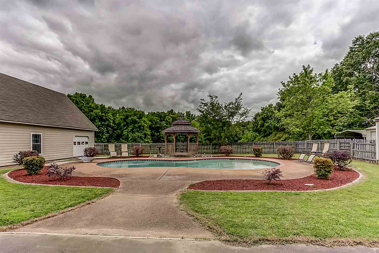 9445 Pleasant Ridge Road Lakeland, TN 38002 - Photo 20 of 21 The backyard also comes equipped with a detached 4 car garage complete with a 10 foot lift, double garage doors and window air conditioning.