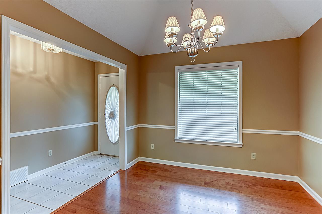 9445 Pleasant Ridge Road Lakeland, TN 38002 - Photo 3 of 21 This 10x10 Dining Room boasts hardwood flooring, chandelier, chair rail, coffered ceiling, 2 inch blinds.