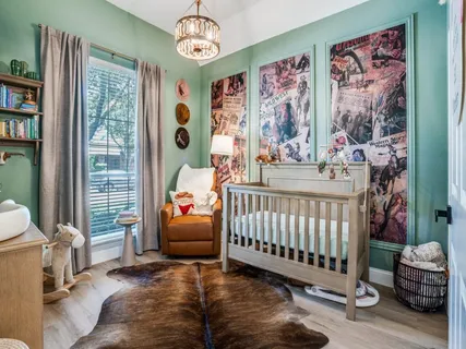 a bedroom with furniture and a large window