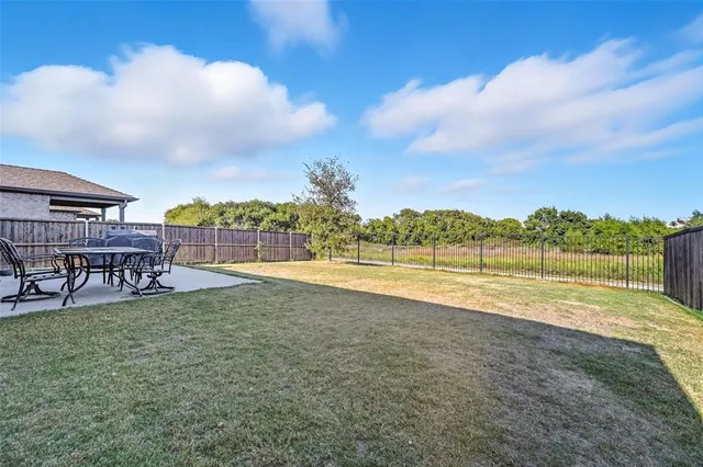 a view of a lake with a yard