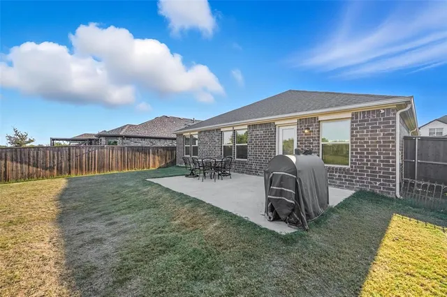 a view of a house with backyard porch and patio